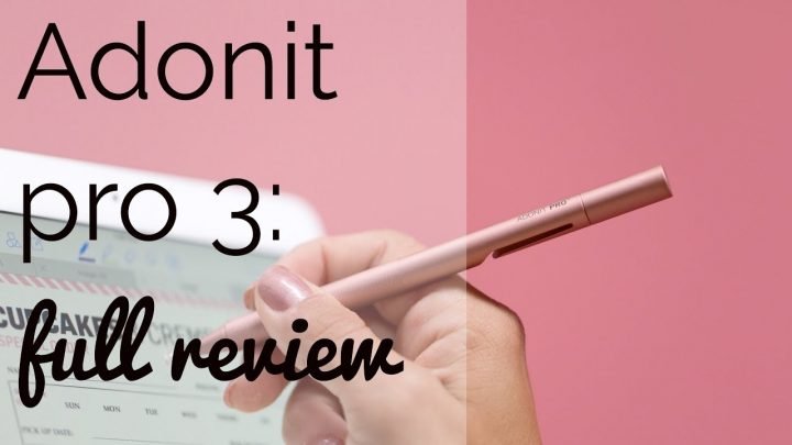 picture of Adonit pro 3, lady holding the stylus with a tablet in the background.